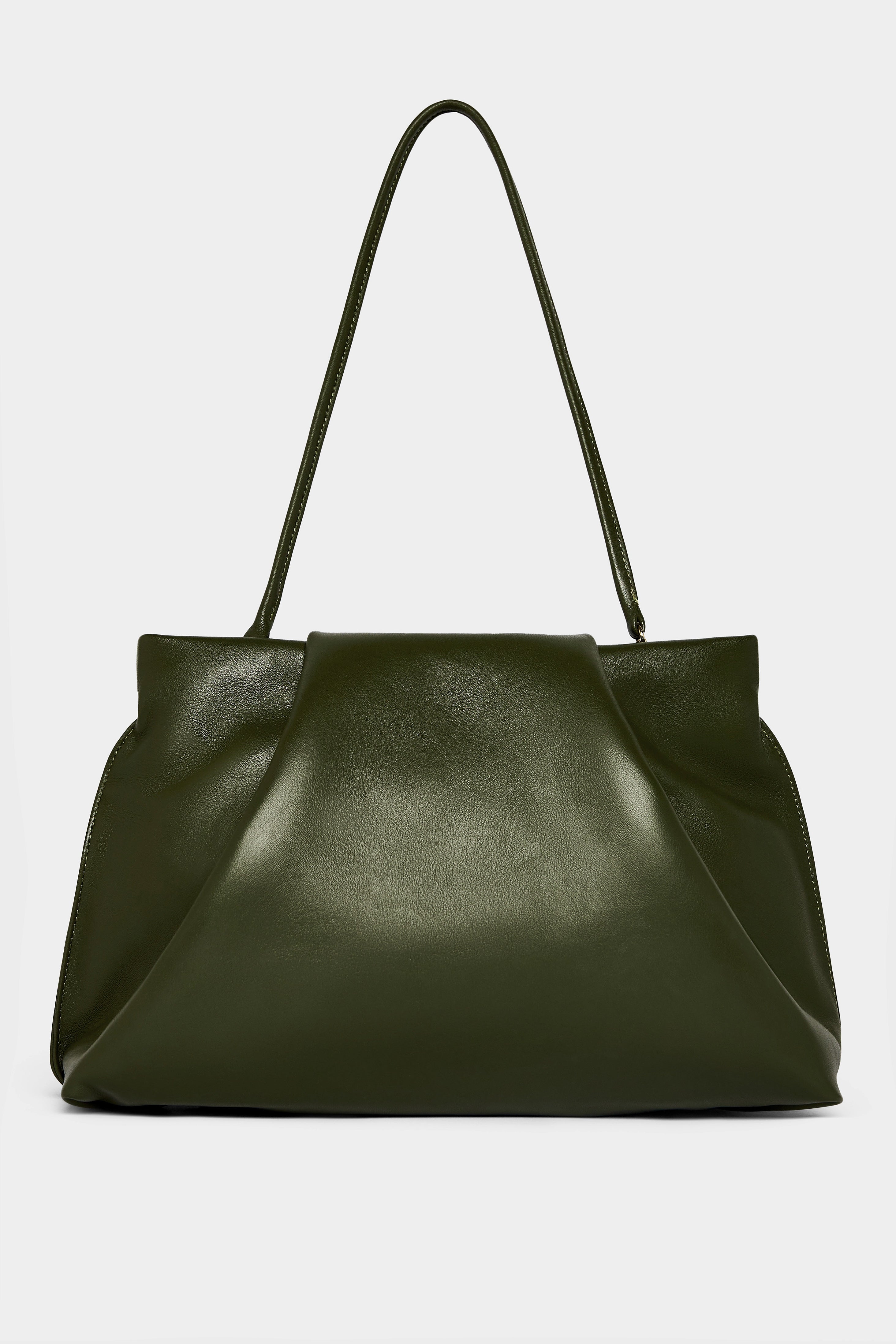 A photo of the black fold clutch bag with its handles up to function as a shoulder bag. The handbag features a modern and structured design.