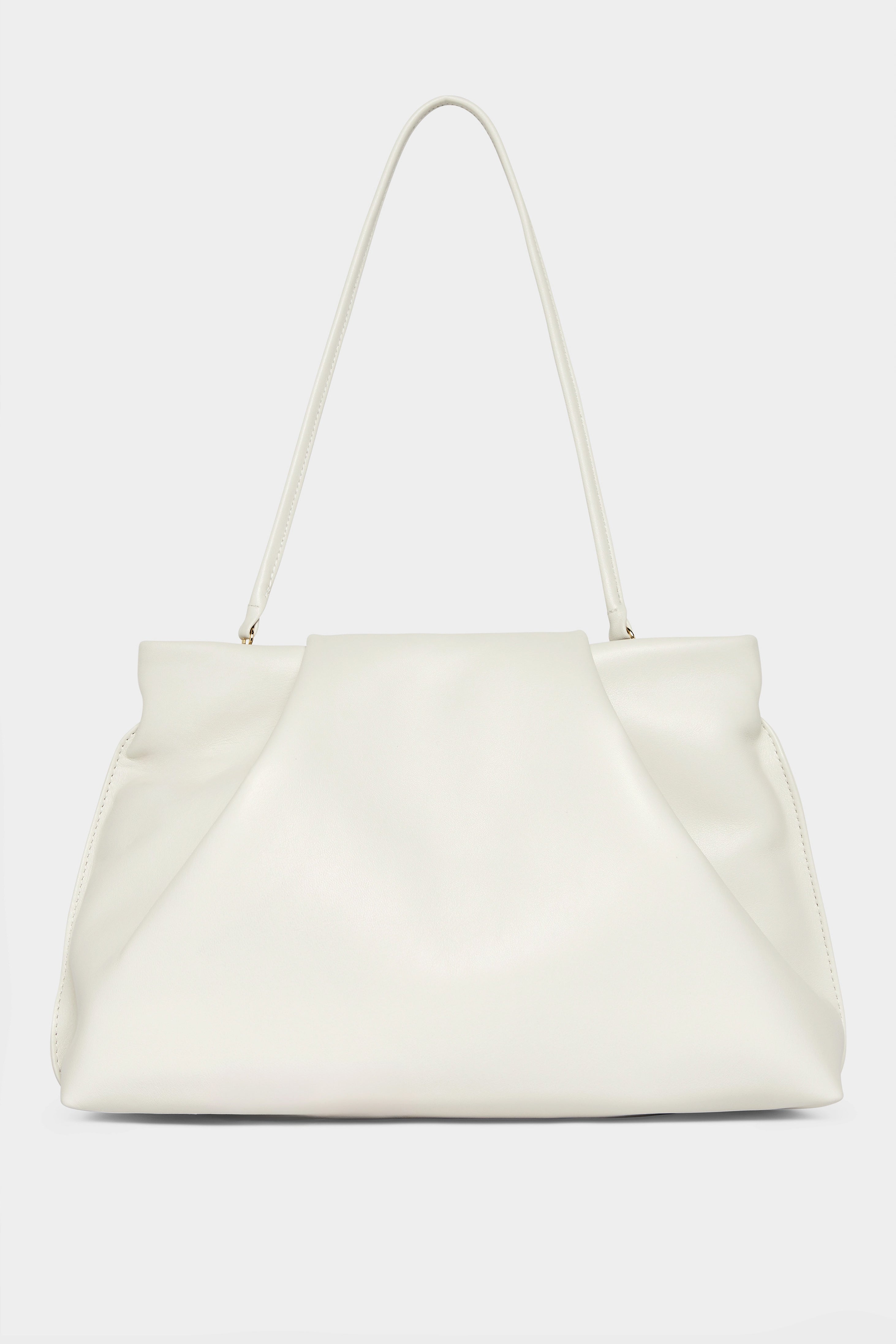 A photo of the black fold clutch bag with its handles up to function as a shoulder bag. The handbag features a modern and structured design.