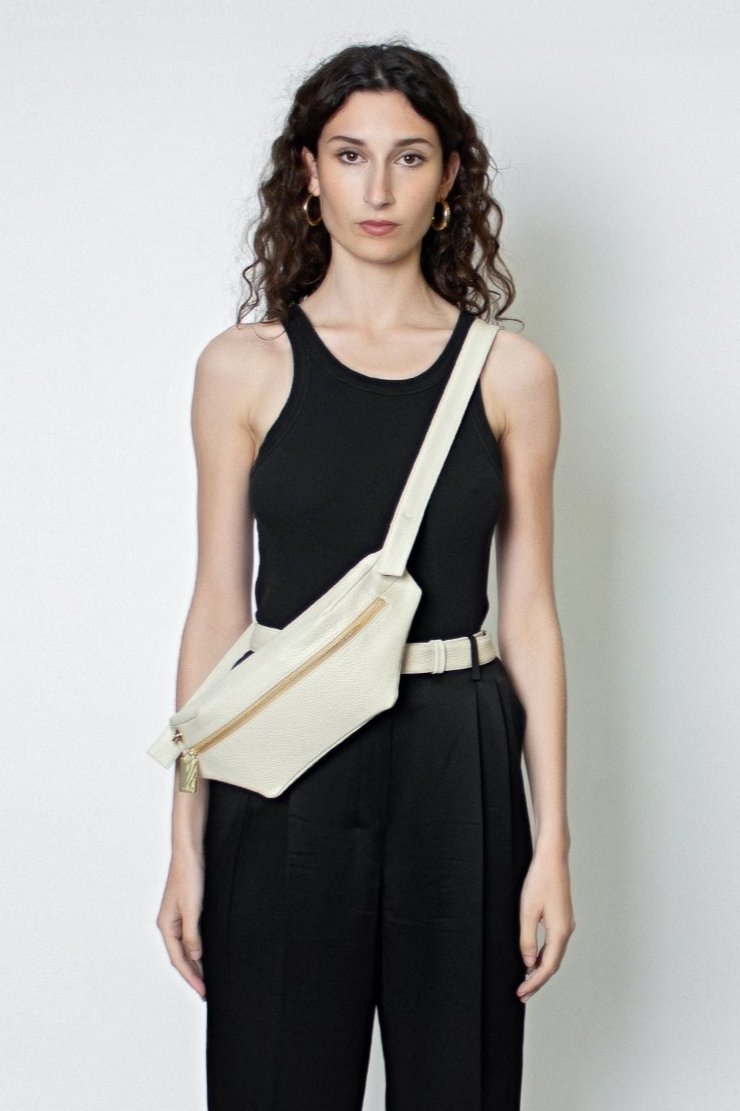 The Oblong Bum Bag worn as a crossbody bag. The belt bag inspired design is suited as an add-on mini travel bag.