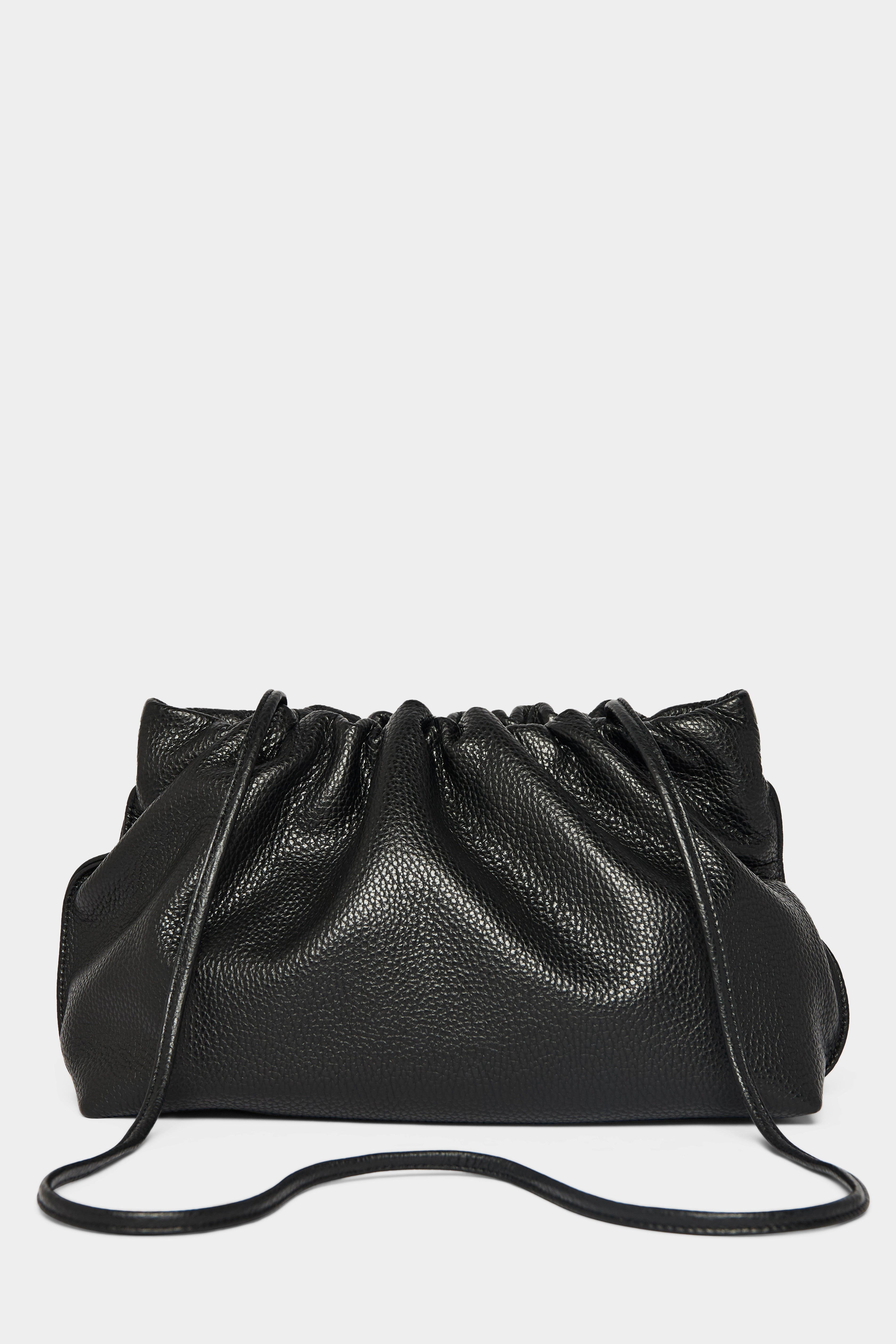 A black clutch bag with a long removable shoulder strap. The handbag can also be worn handheld or a crossbody bag.