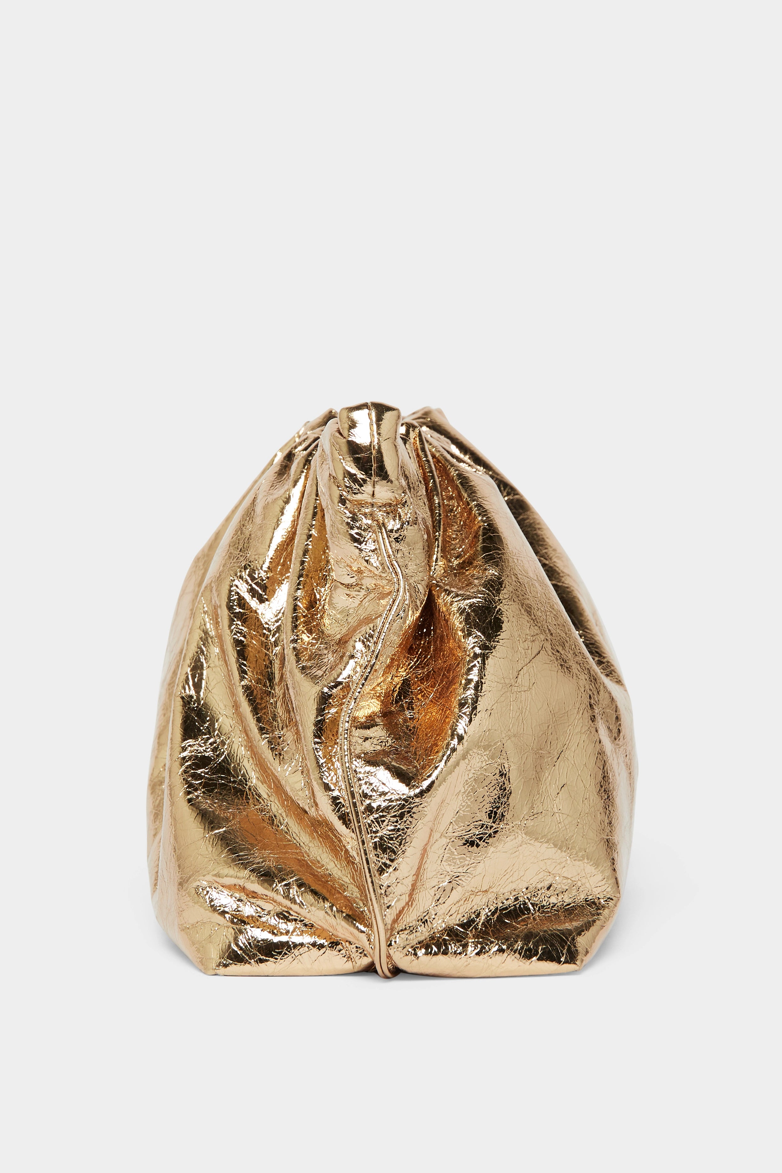 A side angle of the Puffa clutch purse featuring a delicate hand stitching of the mini bag's sides.