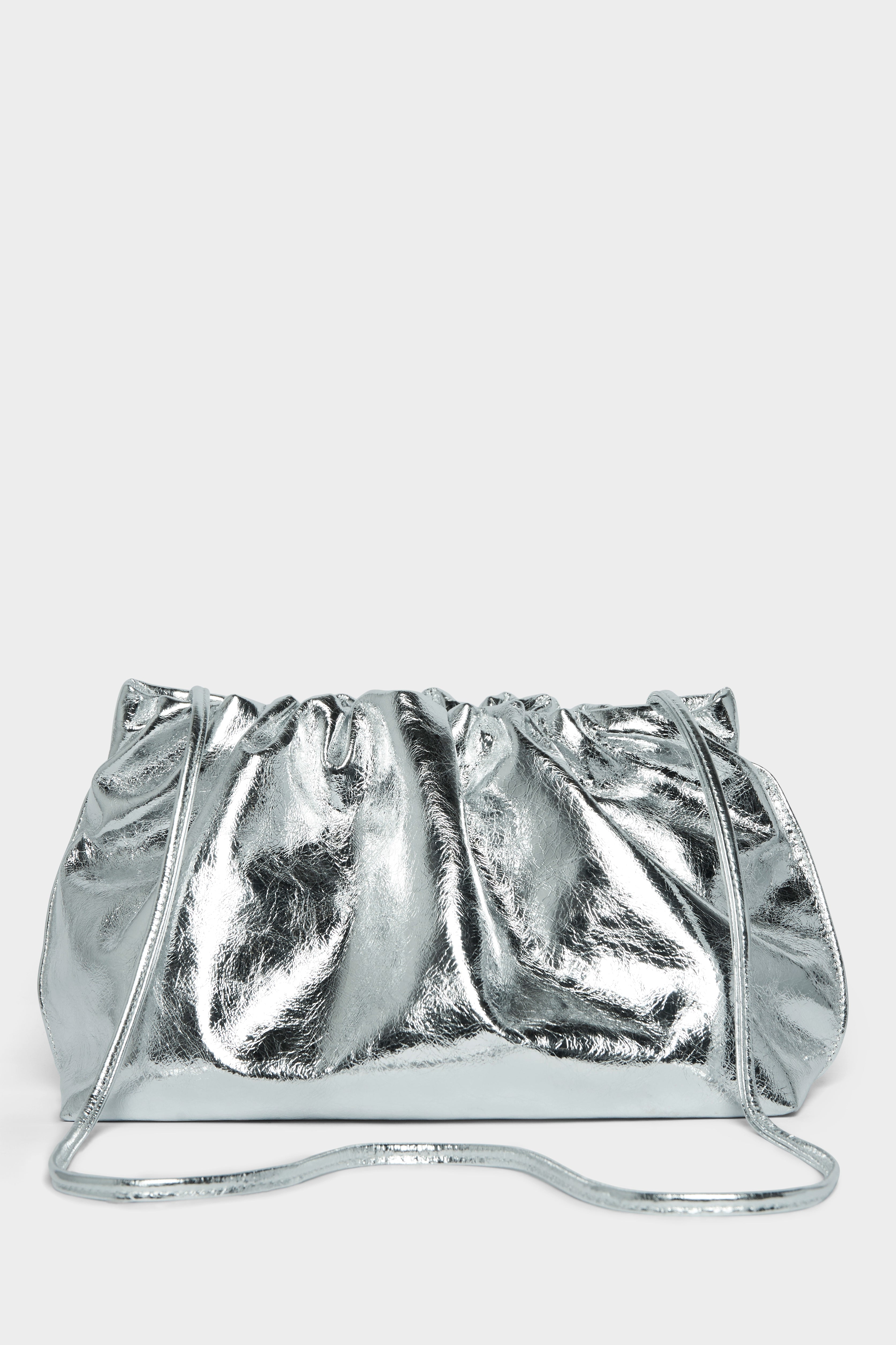 A silver clutch bag with a long removable shoulder strap. The handbag can also be worn handheld or a crossbody bag.