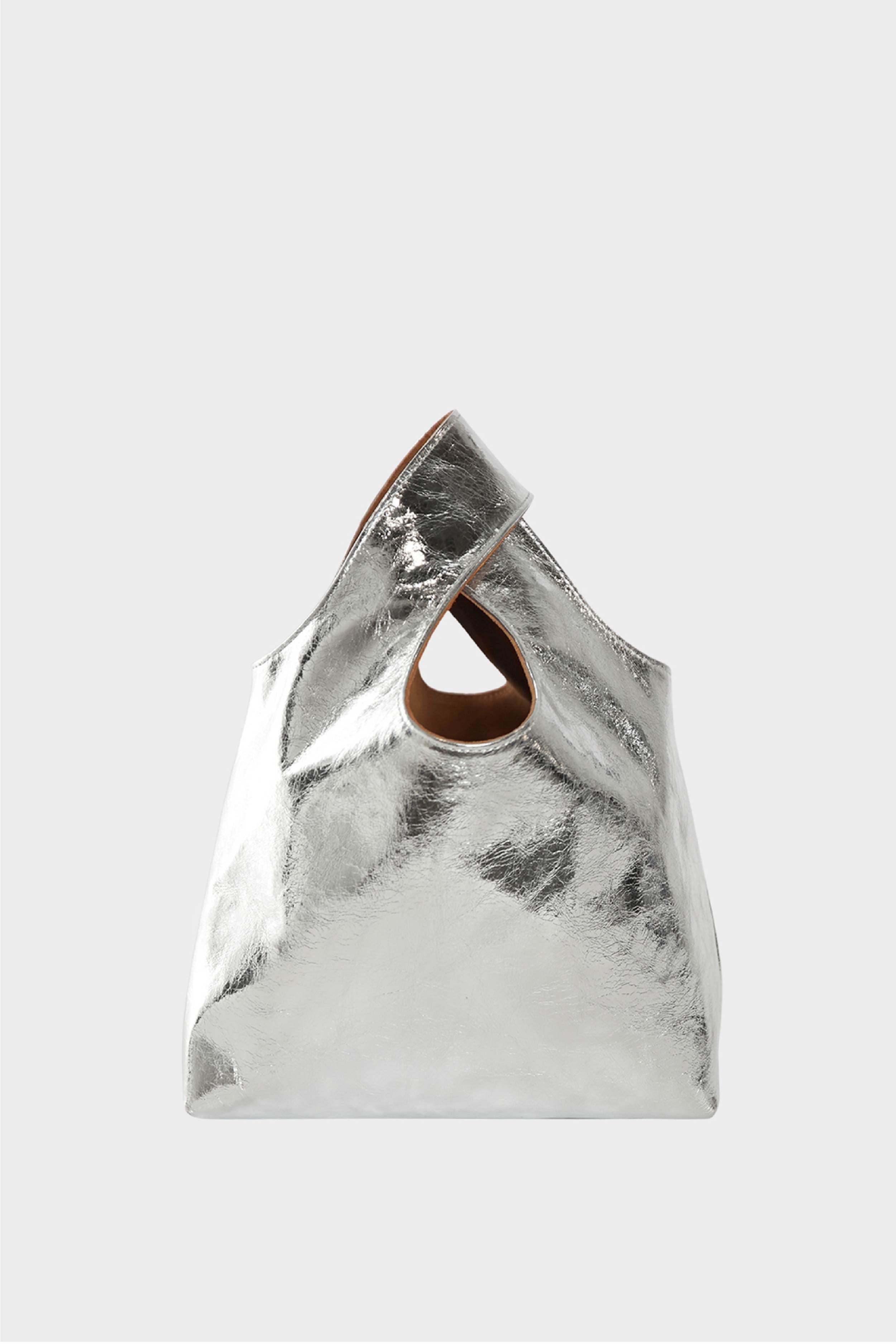 A small silver handbag made of fine Italian leather. This mini bag is suited to carry as a clutch for casual events.