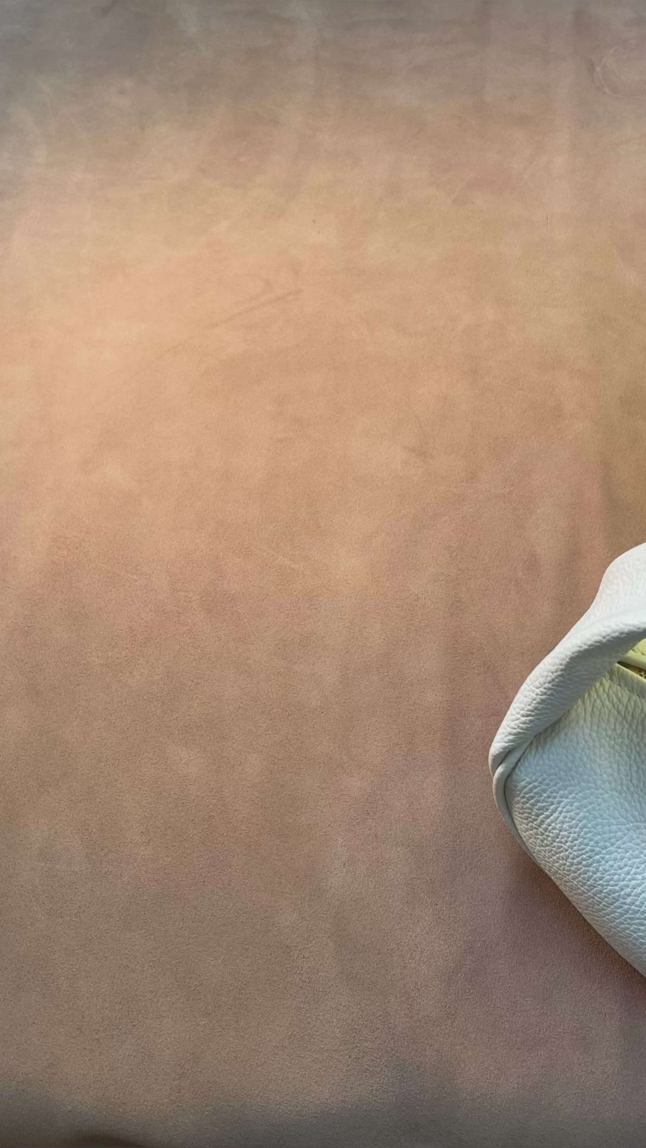 A video of what fits inside the mini bag. It can conveniently fit an iphone, sun glasses, wallet, a mini pouch, airpods, and a small perfume.