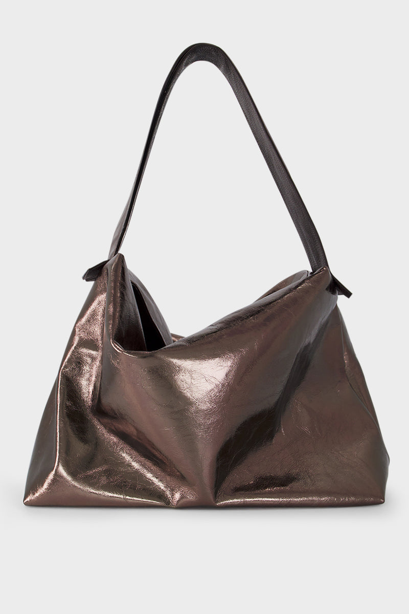 A large metallic brown shoulder bag with two long handles. The handbag is designed as a carry-all travel bag made of fine Italian leather.