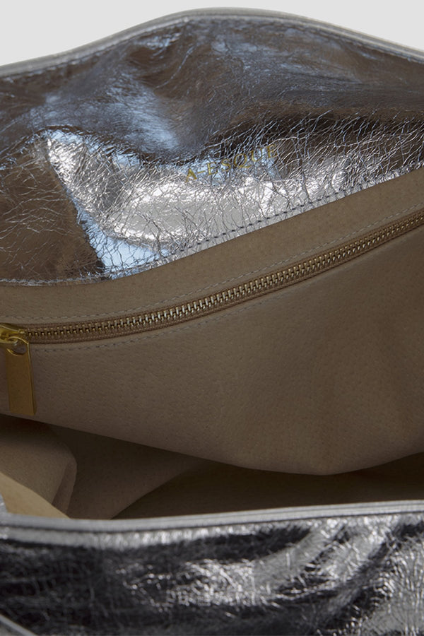 Big Day shoulder bag's interior is lined with suede leather with an interior zipped pocket in gold.