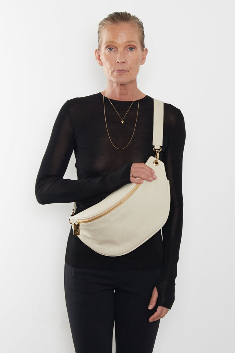 The Creators Crescent worn as a crossbody bag. The long detachable strap allows the bum bag to be worn in different ways.