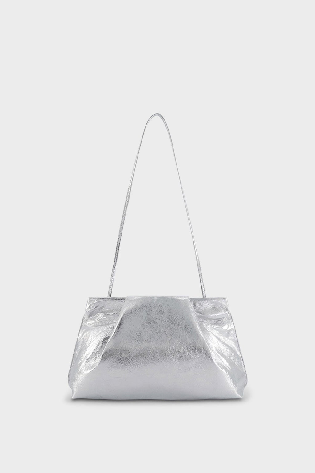 A photo of the silver fold clutch bag with its handles up to function as a shoulder bag. The handbag features a modern and structured design.