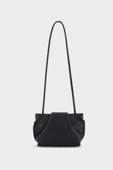 A photo of the black fold mini clutch bag with its handles up. It functions both as   as a shoulder bag and a clutch or purse.