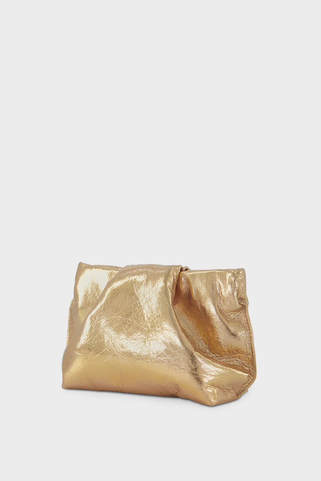 A side angle of the gold mini clutch bag featuring its delicate fold in the middle - a signature design of A-esque's Fold Collection.