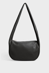 A black crossbody bag with a hobo satchel-inspired design. It’s made of fine Italian grain leather.