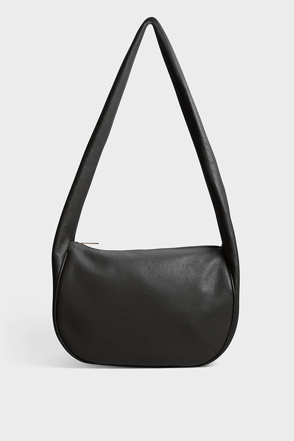 A black crossbody bag with a hobo satchel-inspired design. It’s made of fine Italian grain leather.