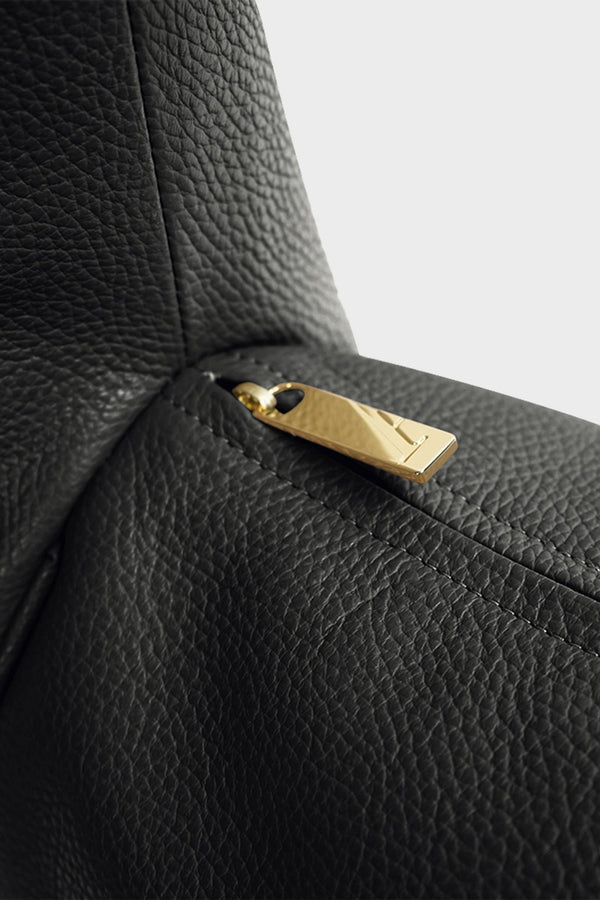 The Halo Day crossbody bag features gold hardware and a durable zipper with the initial “A” engraved for A-esque.