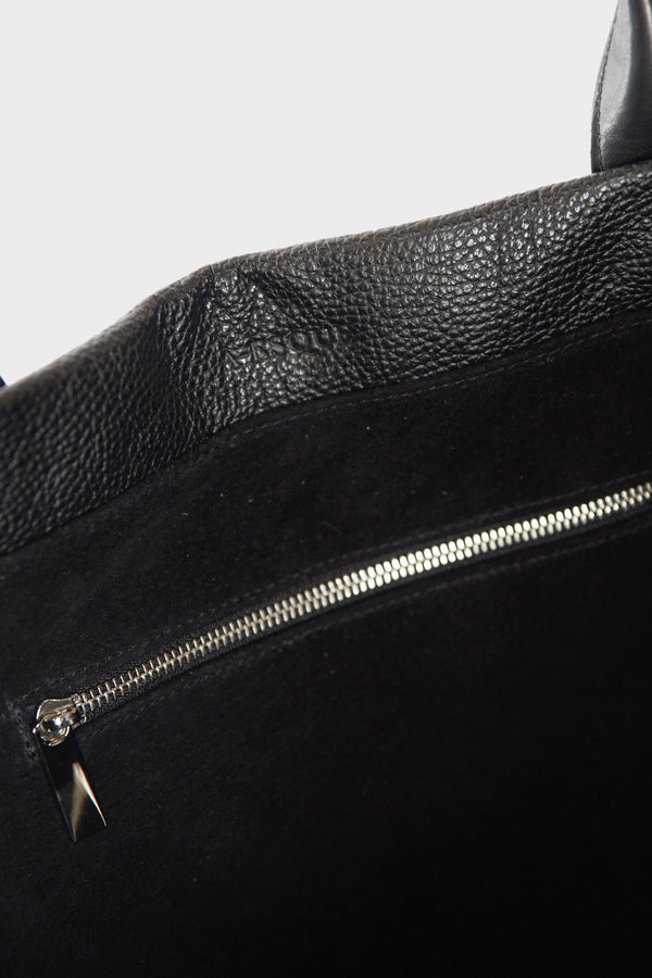 The handbag's interior has 1 zipper pocket in silver hardware. Large Grocer Tote Bag's interior is lined with a black suede leather. 