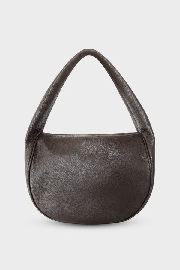 A mid-sized dark brown shoulder bag with a hobo inspired design made of fine Italian grain leather.