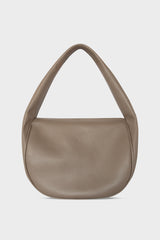 A mid-sized grey shoulder bag with a hobo inspired design made of fine Italian grain leather.