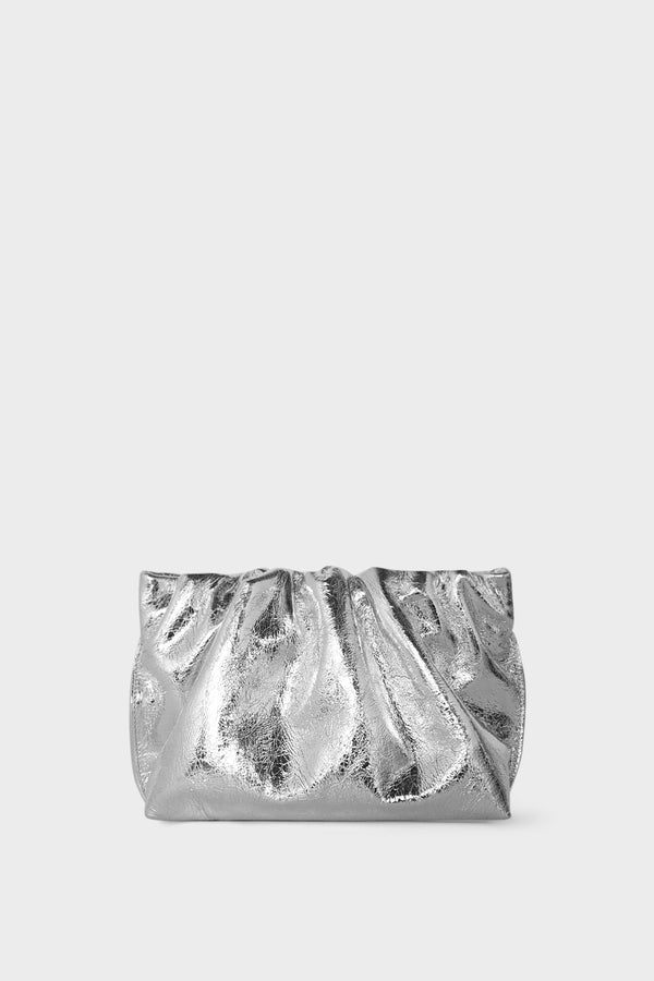 A metallic silver clutch bag made of smooth Italian leather. This mini bag has a long removable strap and can also be worn as a crossbody bag.