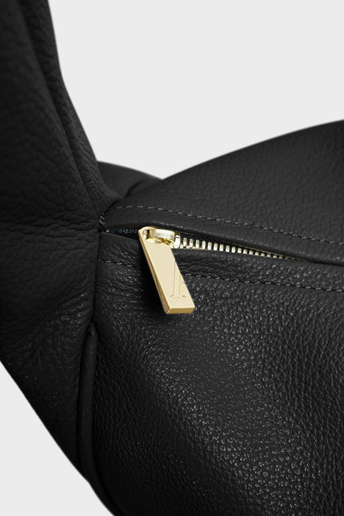 Midi Halo Day shoulder bag in black features gold hardware and a zipper with fine hand stitching.