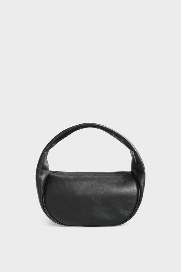 A black mini bag. This handbag is similar to a clutch but with one handle connecting its body. It’s made of Italian smooth leather.