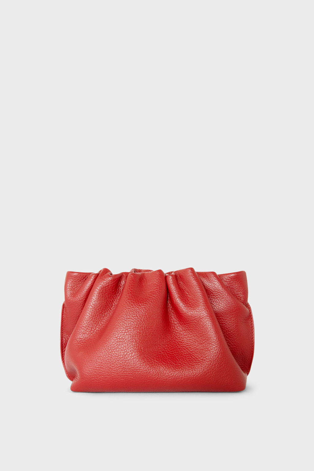 A red mini clutch bag made of grain Italian leather. This mini bag has a long removable strap and can also be worn as a crossbody bag.