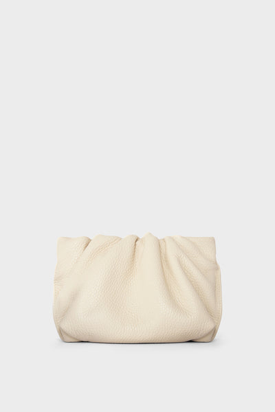 A white mini clutch bag made of grain Italian leather. This mini bag has a long removable strap and can also be worn as a crossbody bag.