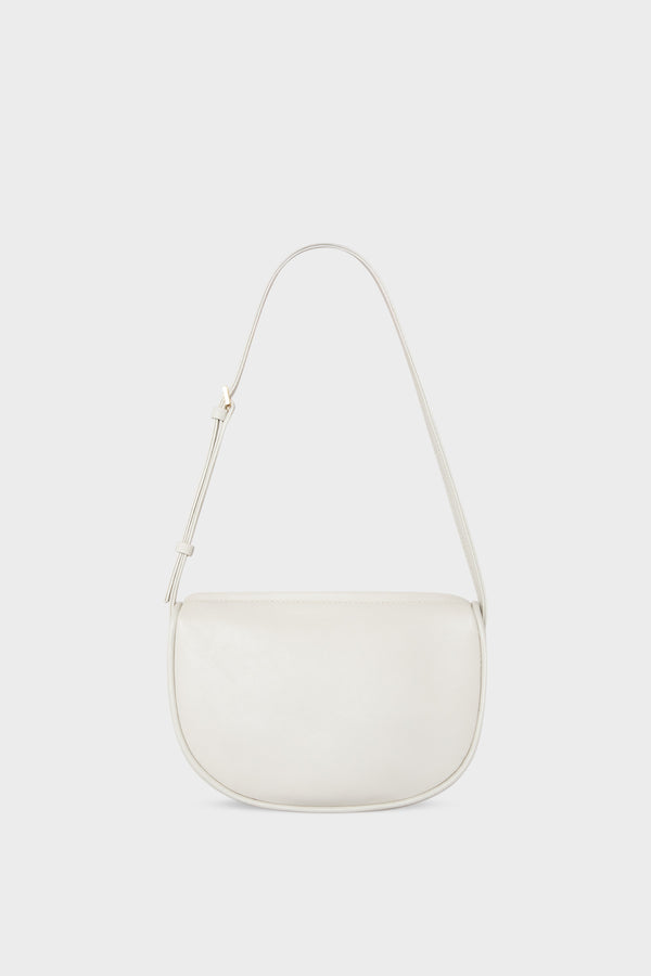 A mini shoulder bag in white made of fine smooth Italian leather. The handbag follows a hobo design with an adjustable shoulder strap.