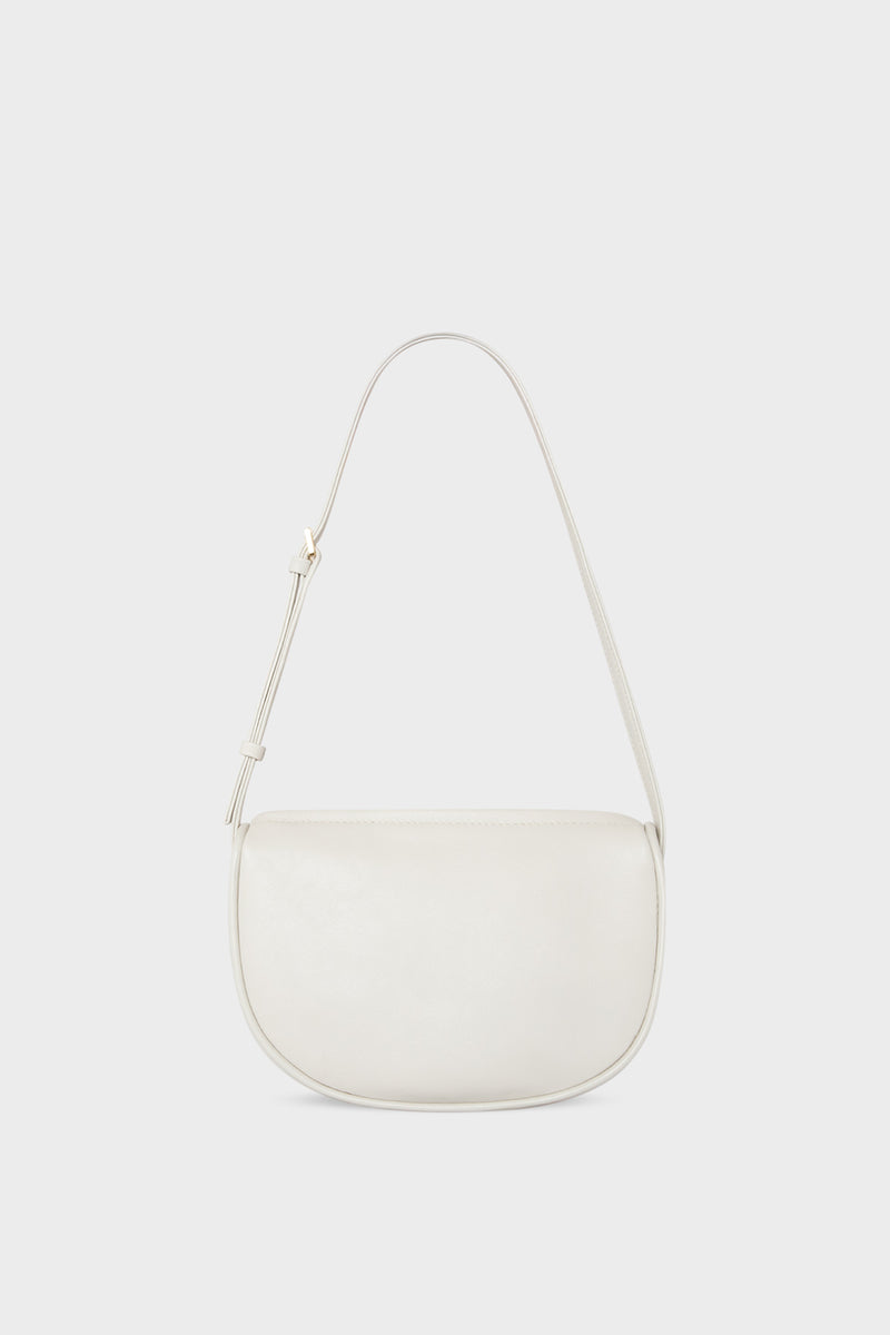 A mini shoulder bag in white made of fine smooth Italian leather. The handbag follows a hobo design with an adjustable shoulder strap.