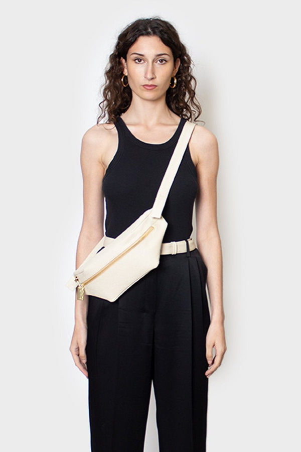 The Oblong bum bag worn crossbody. Its long adjustable straps can be worn as a crossbody bag or as a shoulder bag and belt bag. 