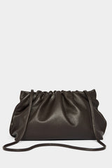 A dark brown clutch bag with a long removable shoulder strap. The handbag can also be worn handheld or a crossbody bag. 