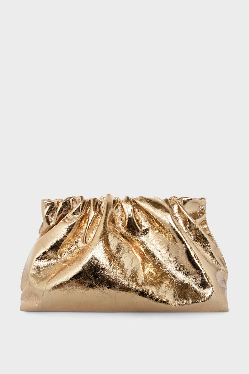 A gold clutch bag made of Italian leather. The handbag has a removable strap and can also be worn as a crossbody bag.