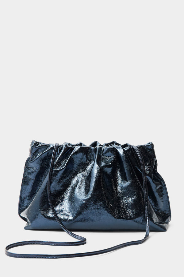 A metallic blue clutch bag with a long removable shoulder strap. The handbag can also be worn handheld or a crossbody bag. 