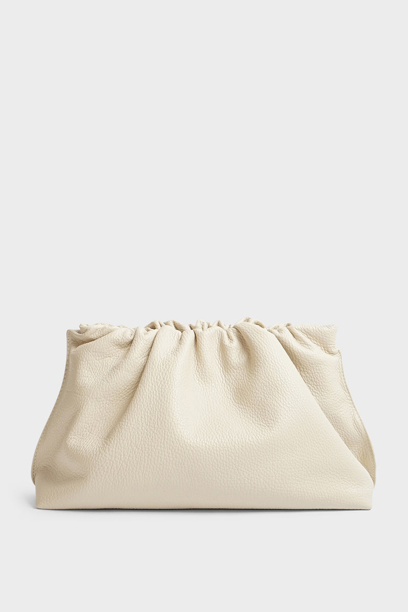 A white clutch bag made of grain Italian leather. The handbag has a removable strap and can also be worn as a crossbody bag.