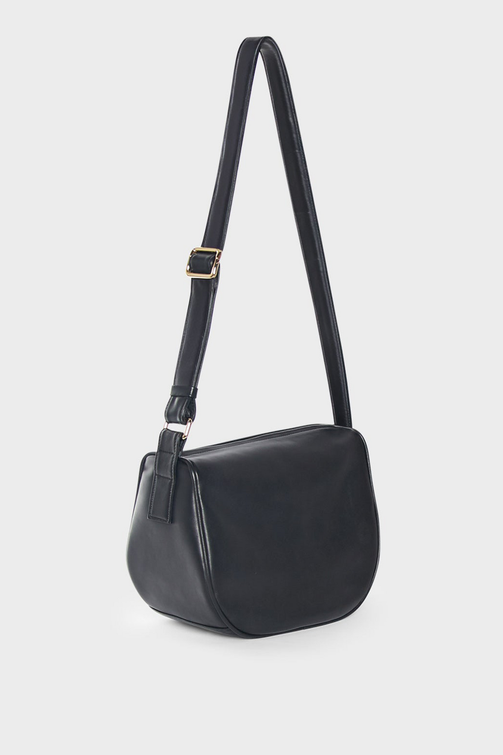 A side image of a medium-sized crossbody bag with a hobo satchel design. The bag features a compact design and an adjustable strap.