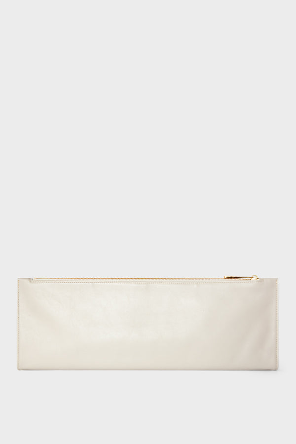 An off white long clutch that is foldable. When opened to its full size, the clutch becomes a slim document leather pouch.