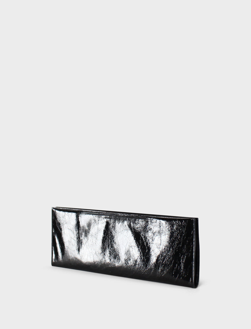 A side image of the slimline clutch pouch. The handbag is folded and looks like a long wallet. It's suited as a party clutch or a casual pouch or purse.