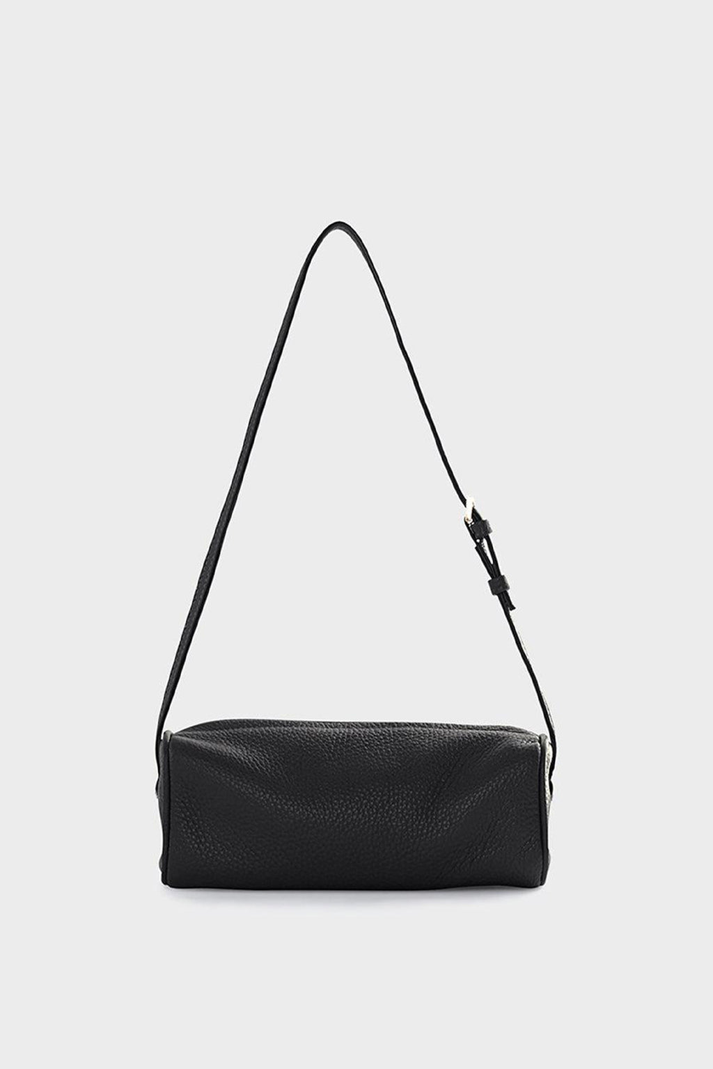 A small black shoulder bag made of grain Italian leather. The bag has a compact design and features an adjustable strap handle.