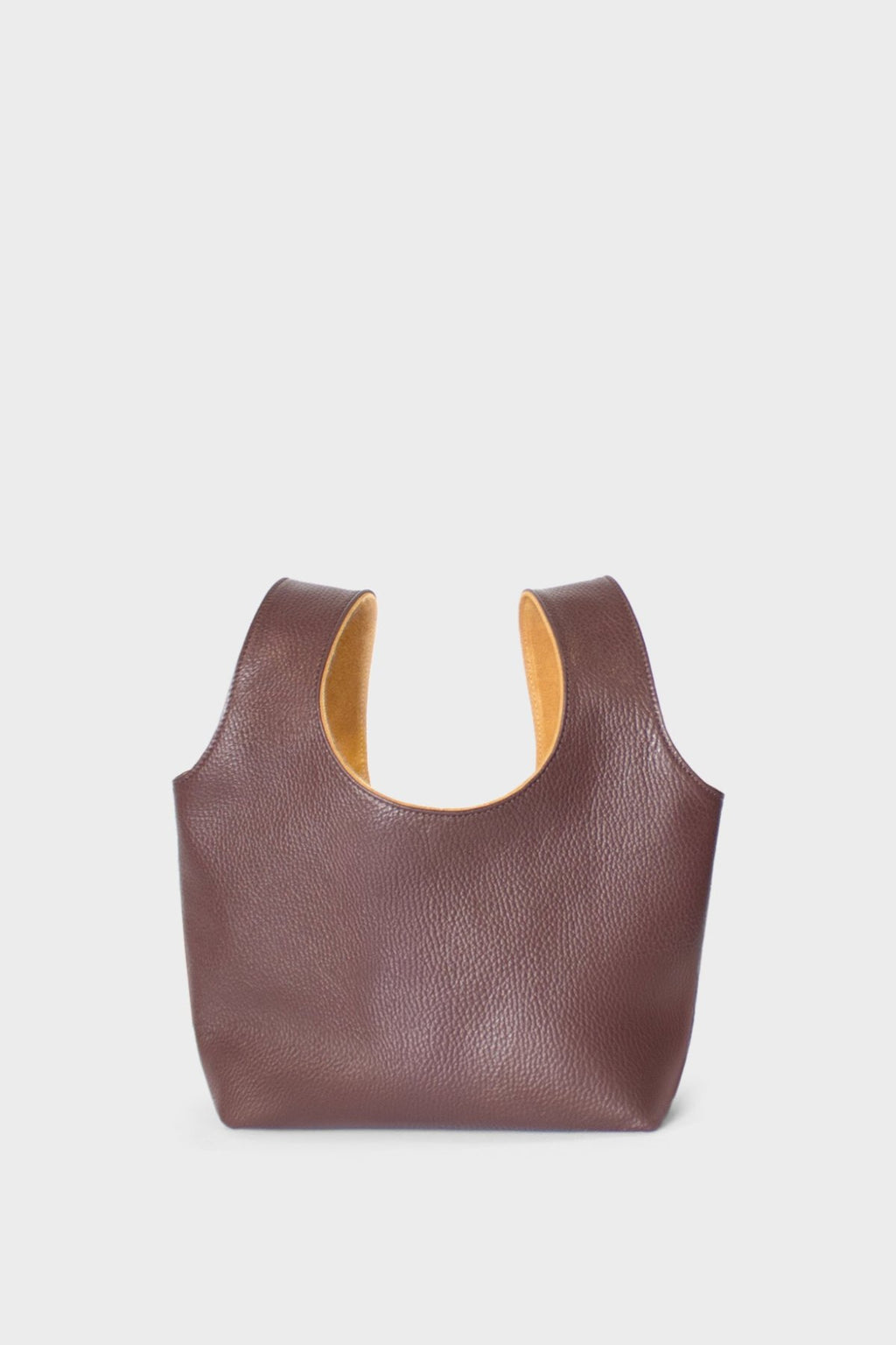 A burgundy mini bag. This handbag has a playful and casual design suited as a party purse or clutch.