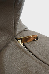 Halo Day shoulder bag in grey elephant features a gold hardware and zipper with fine hand stitching.